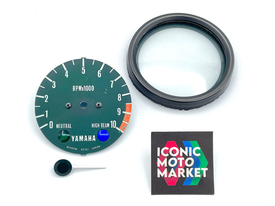 Yamaha RD250 (1973-1987) Tachometer Face, Bezel w/ Glass. (OEM) #201657572